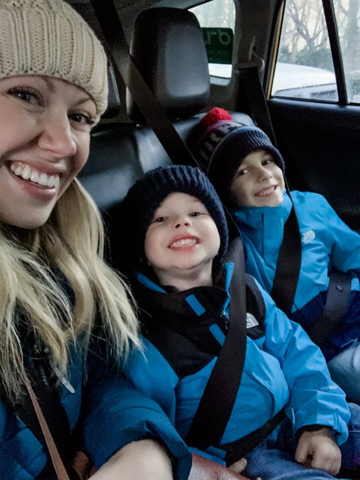 Lauren, Eddie and Blake taking a selfie in a car