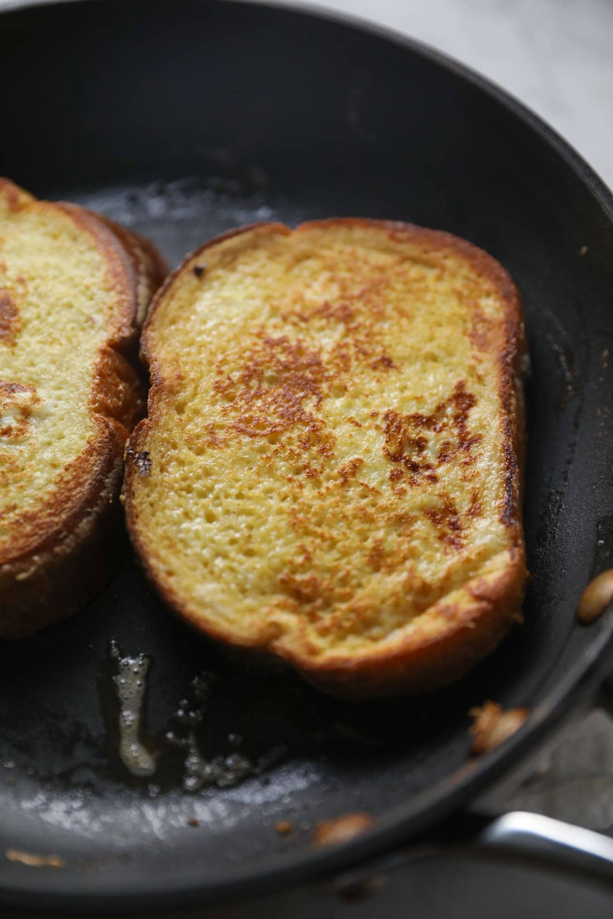 Frying french toast in a skillet