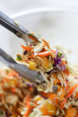 chinese asian slaw toss with tongs