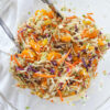 chinese asian slaw in bowl with tongs