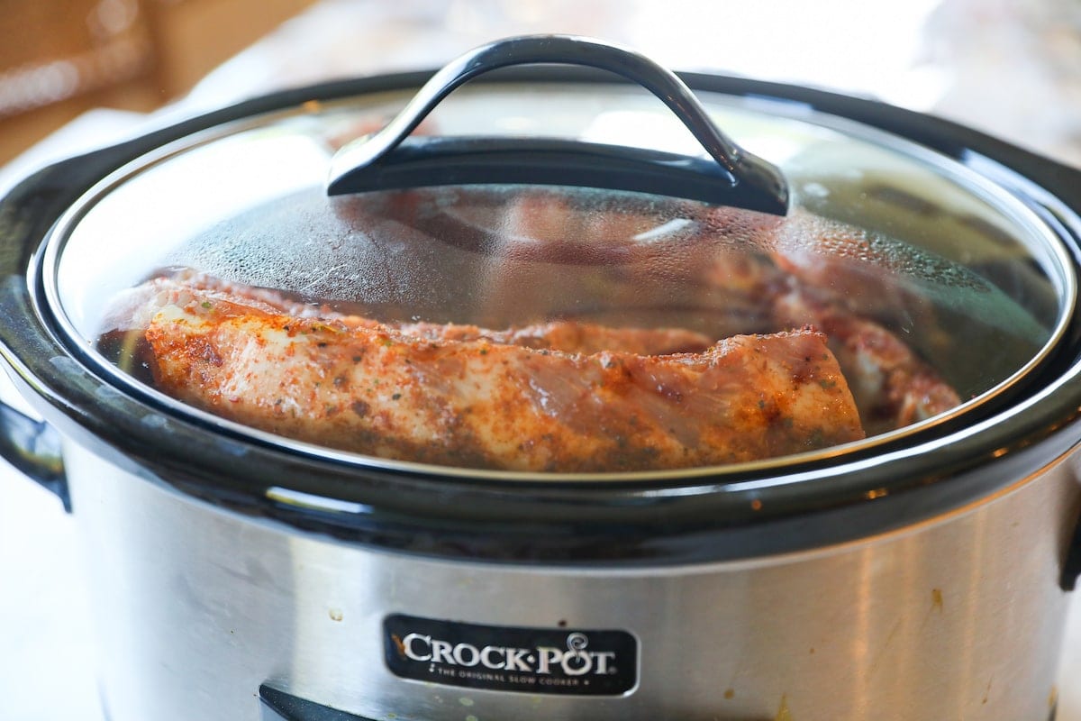 covered crockpot with ribs inside