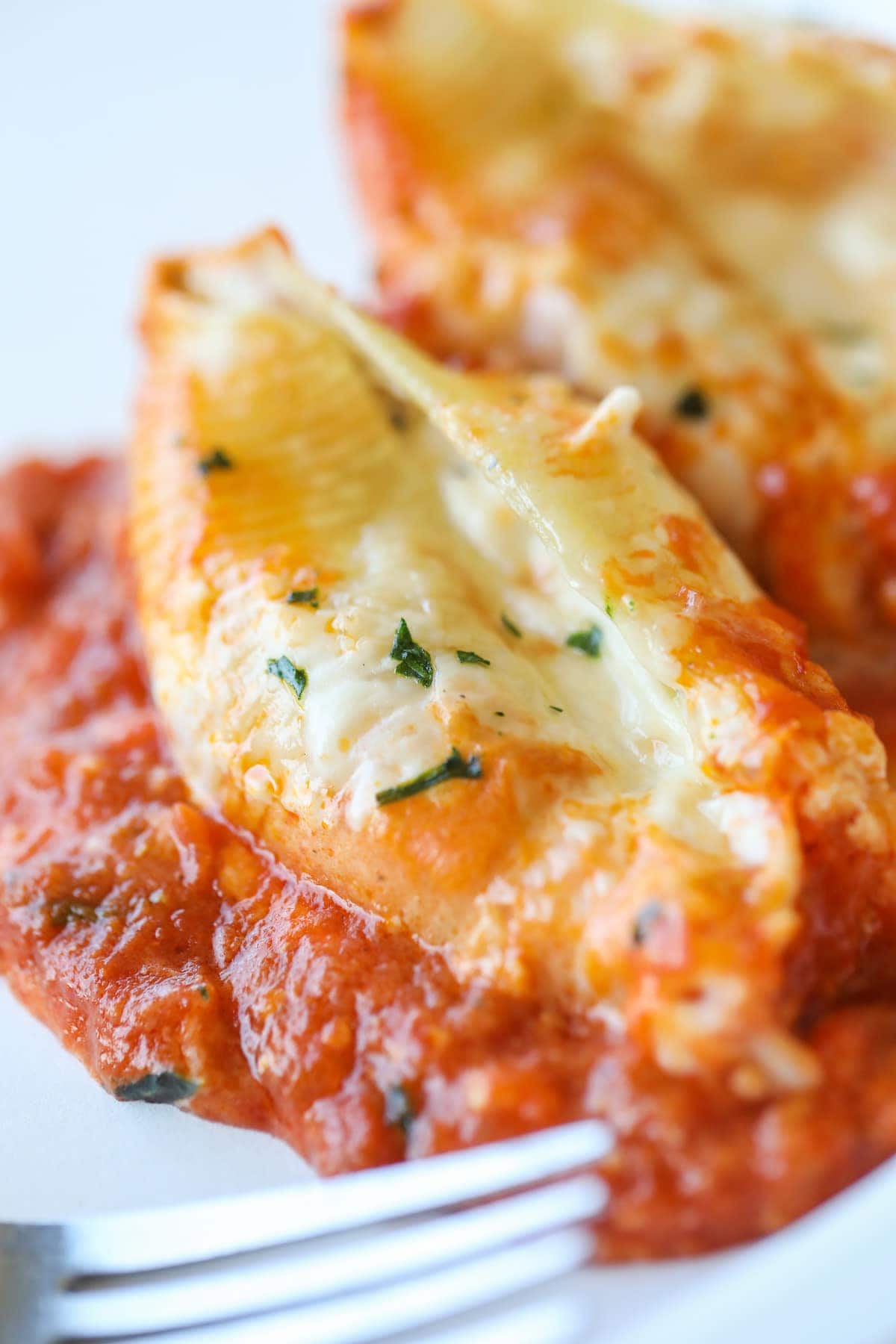 close up stuffed shells with sauce