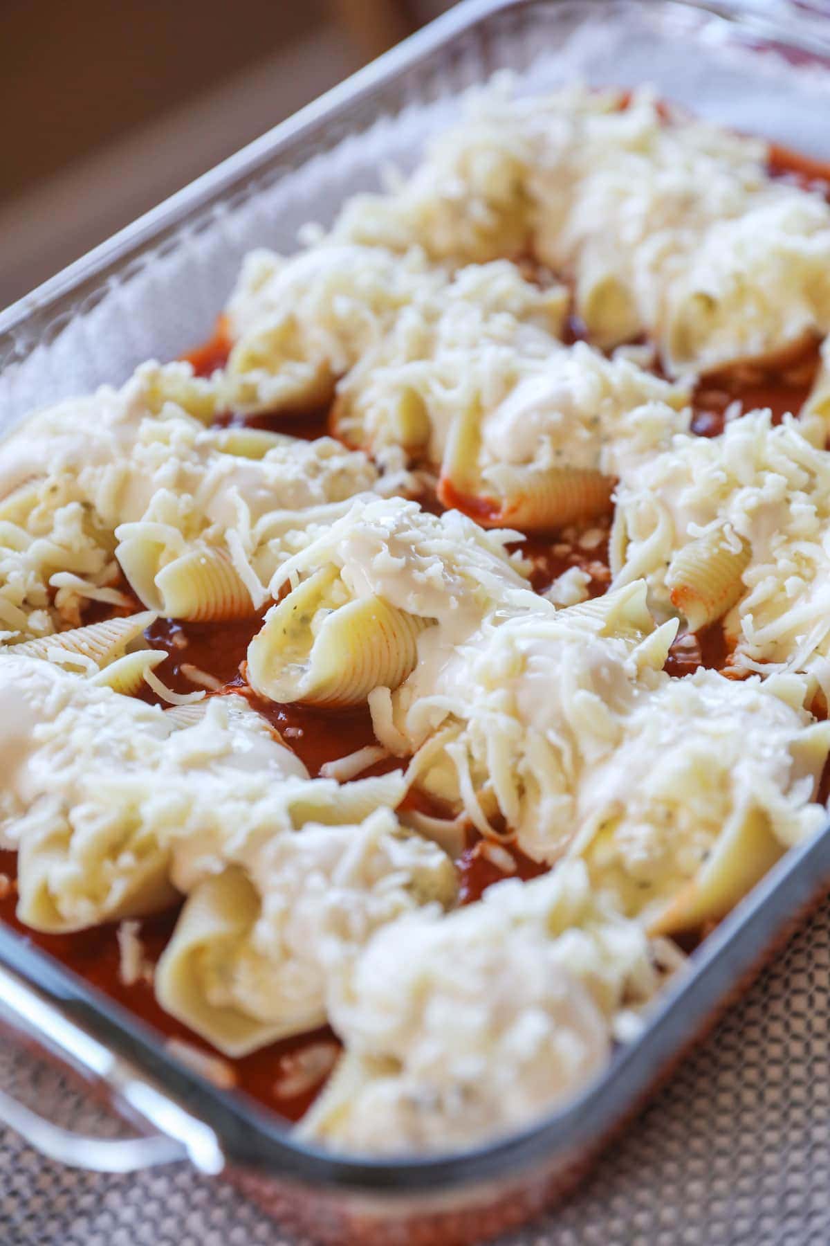 stuffed shells in pan with cheese