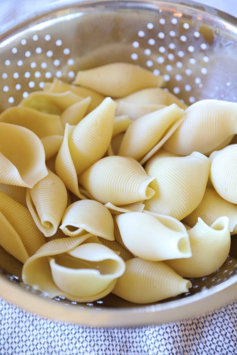 cooked shells in collander