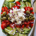 overhead shot of greek salad in oval bowl