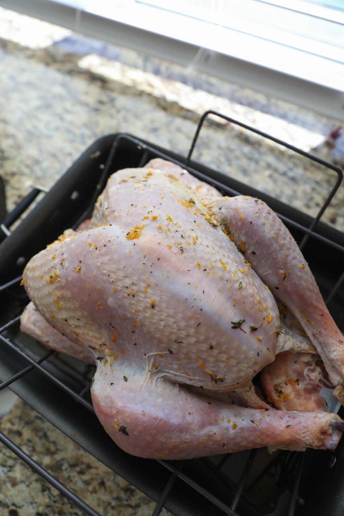 dry brine turkey ready for the oven in roasting pan