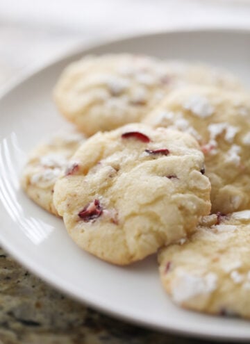 cranberry orange cookies on white plate