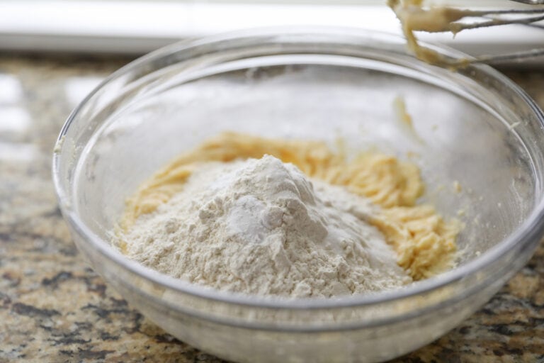 adding dry ingredients into cookie dough