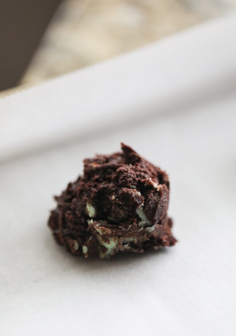 mint chocolate cookie dough scooped on baking sheets