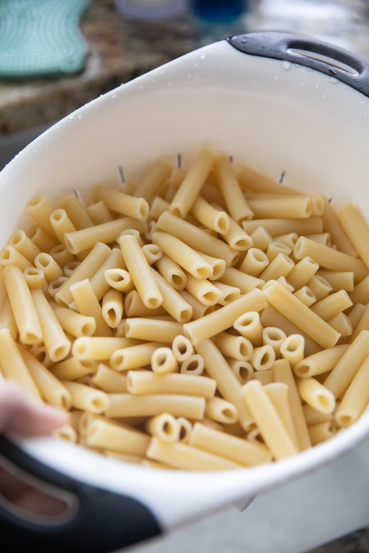 cooked ziti pasta in colander