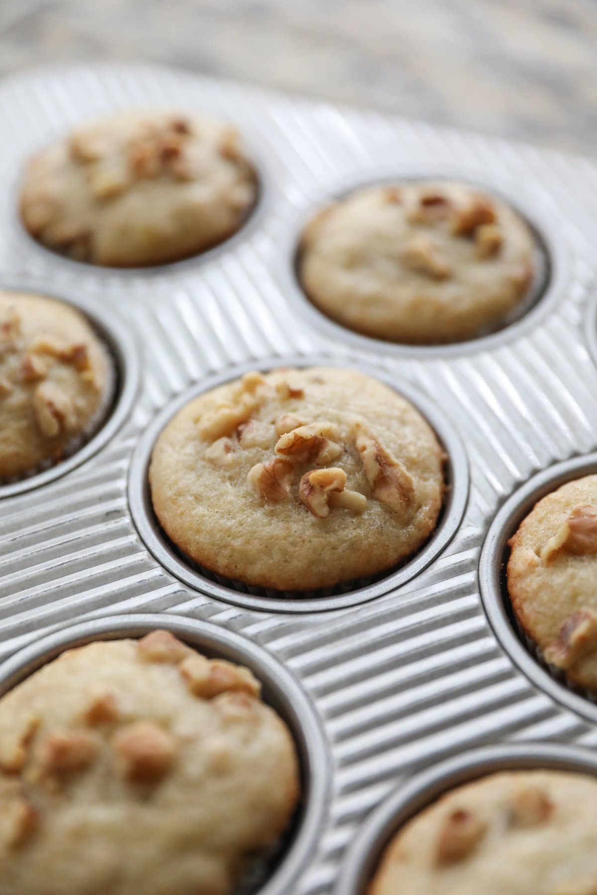 baked banana nut muffins in muffin tin