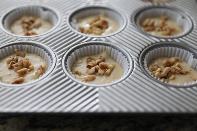 unbaked muffin batter in muffin tin