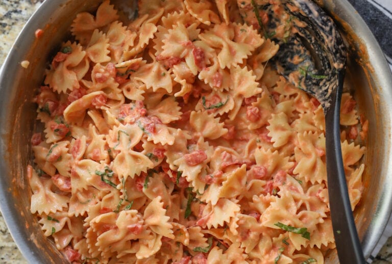 bow tie pasta with sauce in pan
