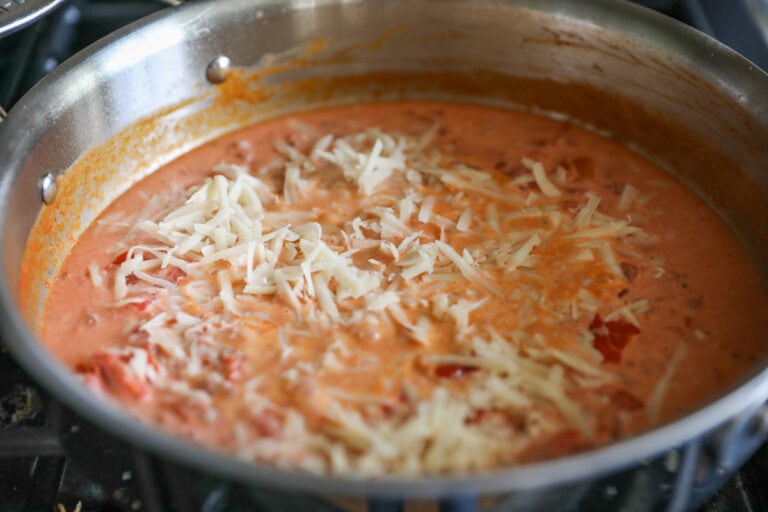 parmesan cheese added to creamy tomato sauce