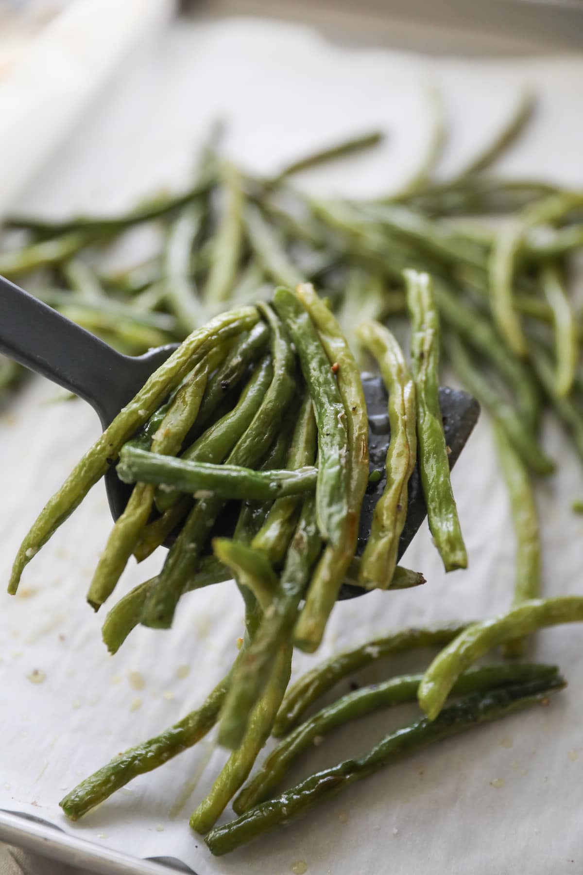 roasted green beans on spatula