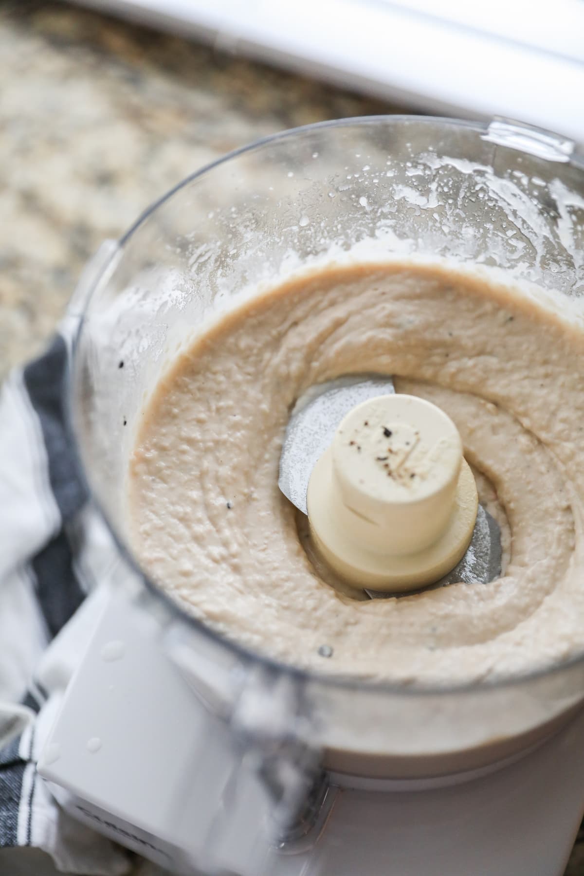 blended white bean hummus in food processor