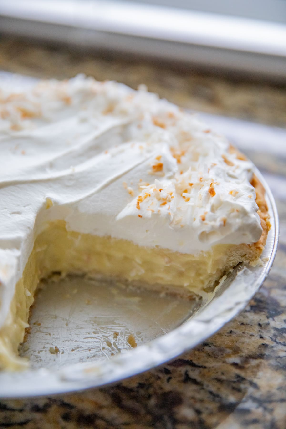 slice missing from coconut cream pie