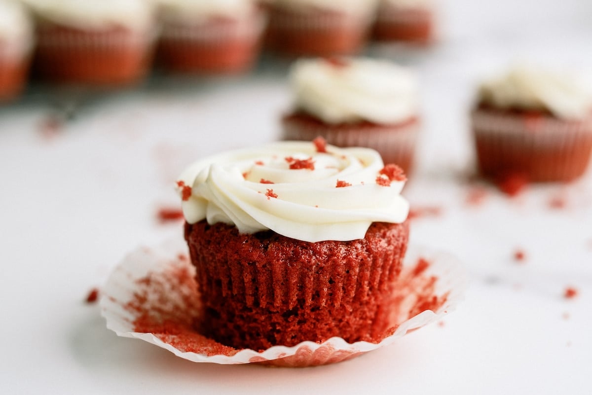 unwrapped red velvet cupcake with cream cheese frosting