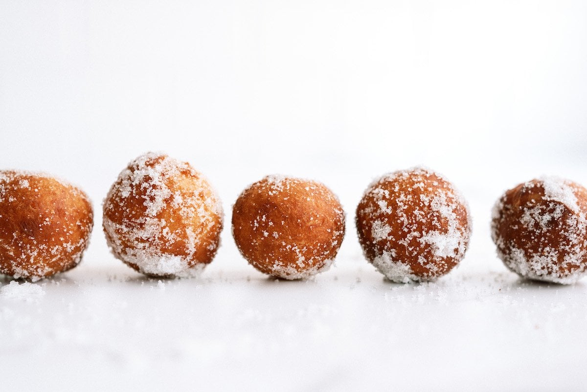 five donut holes lined up in a row