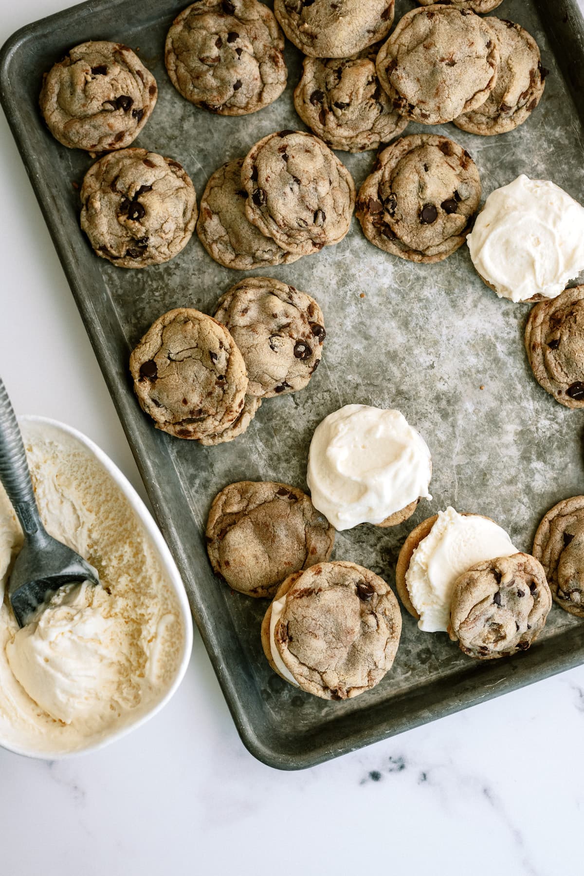 filling chocolate chip cookies with vanilla ice cream