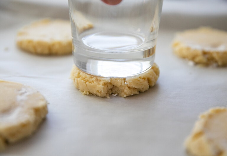 pressing cookie dough with glass