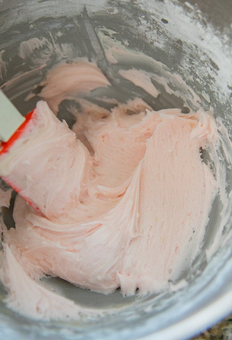 pink frosting in bowl