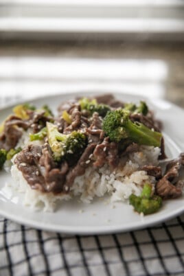 beef and broccoli on plate with rice