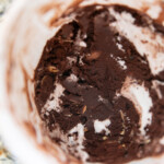 rocky road ice cream frozen in a plastic container