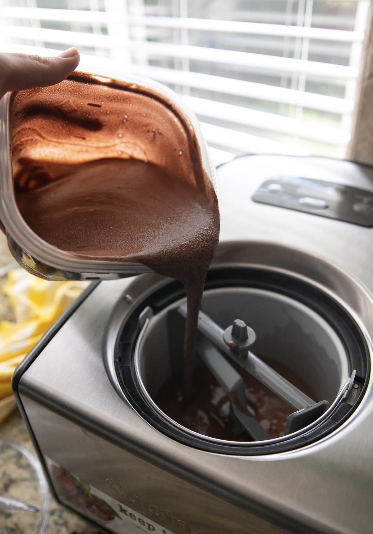 pouring chocolate base into ice cream maker