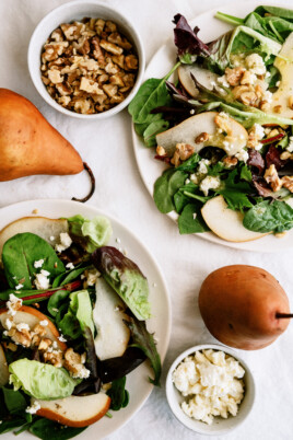 pear salads with whole pears on counter