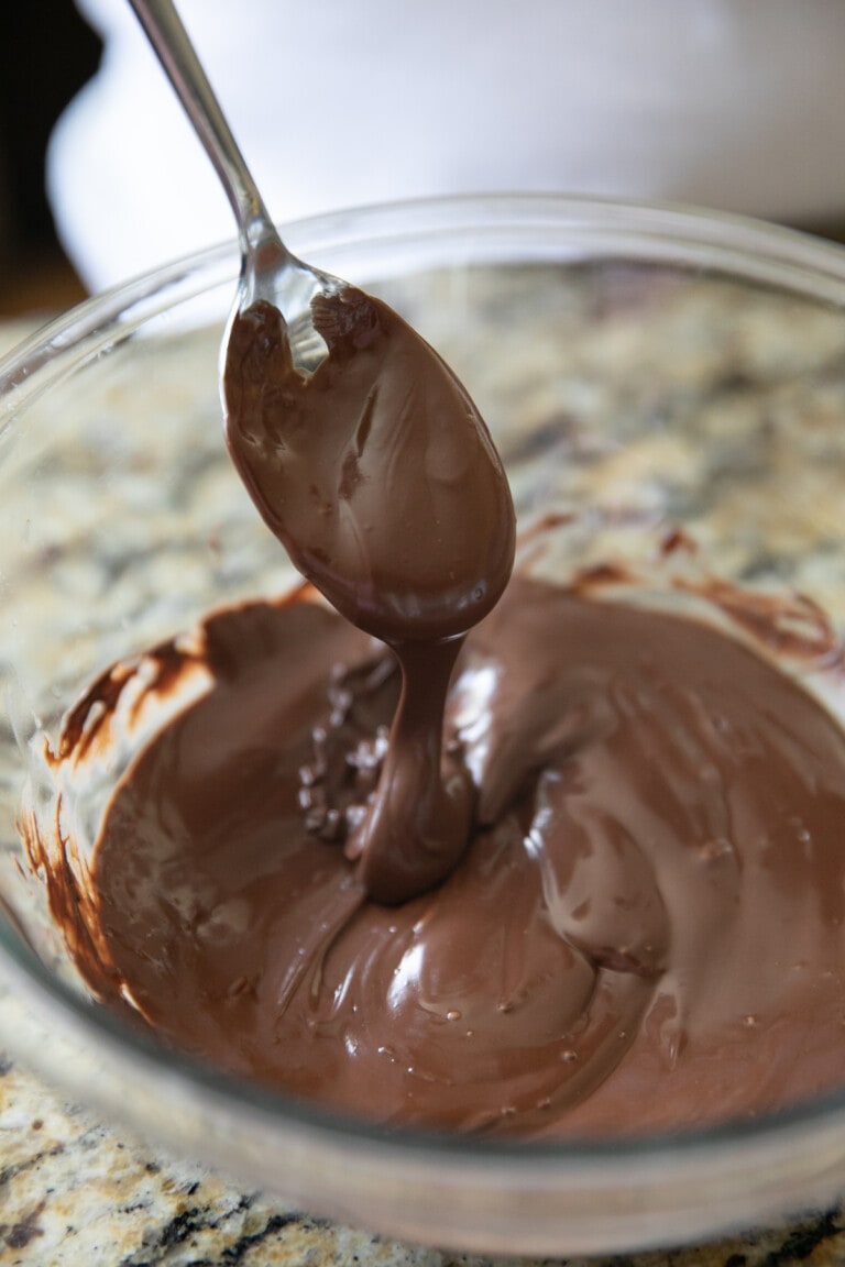 stirring melted chocolate with a spoon