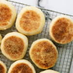 top down view of english muffins on a cooling wrack