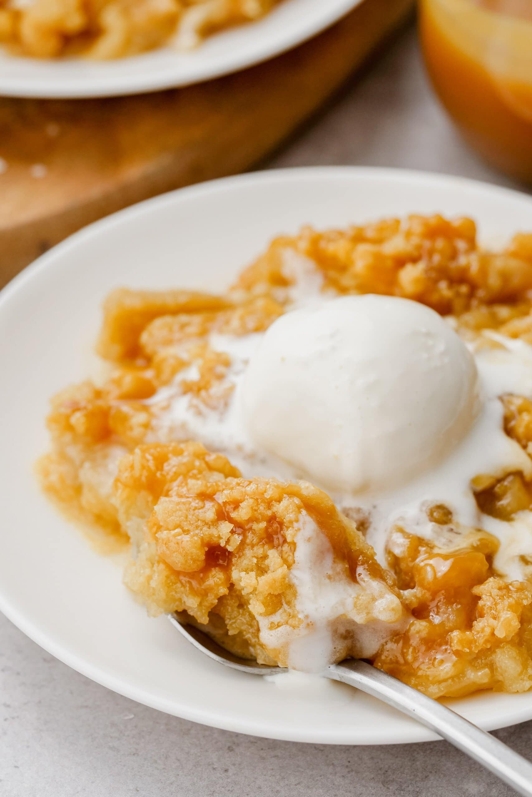 salted caramel apple crumble with a scoop of vanilla ice cream