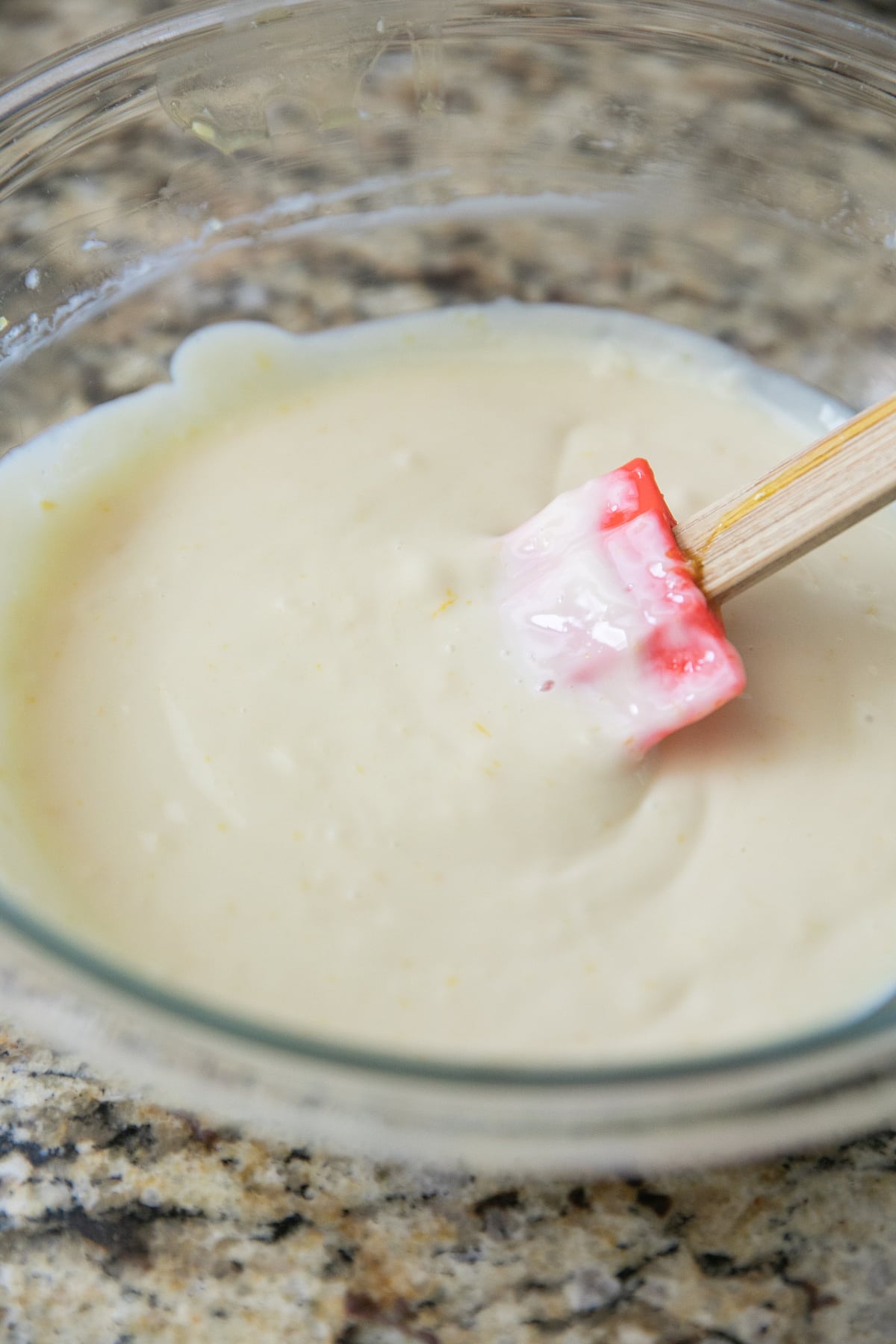 lemon mixture in a glass bowl with a spatula in it