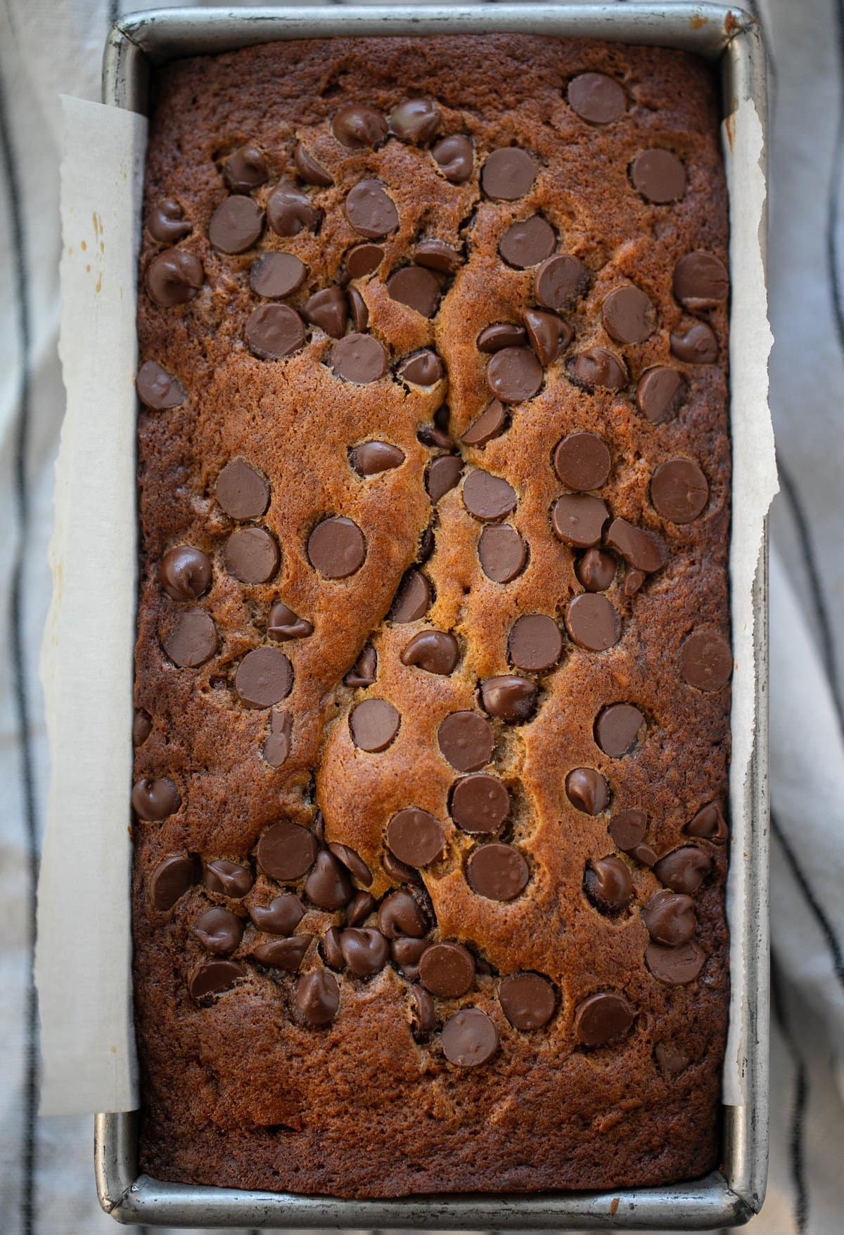 baked chocolate chip banana bread in loaf pan