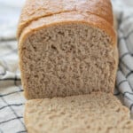 loaf of whole wheat bread with two slices
