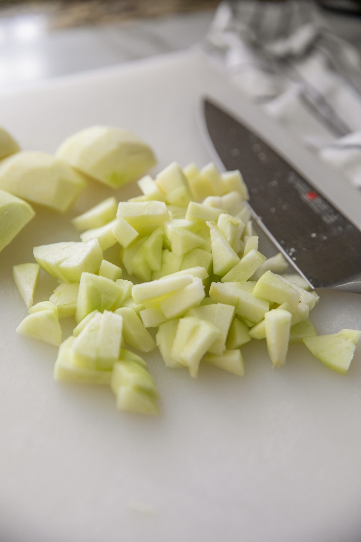 dicing apples on cutting board