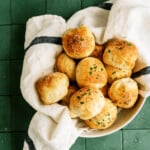 parmesan bread bites in a bowl with a towel