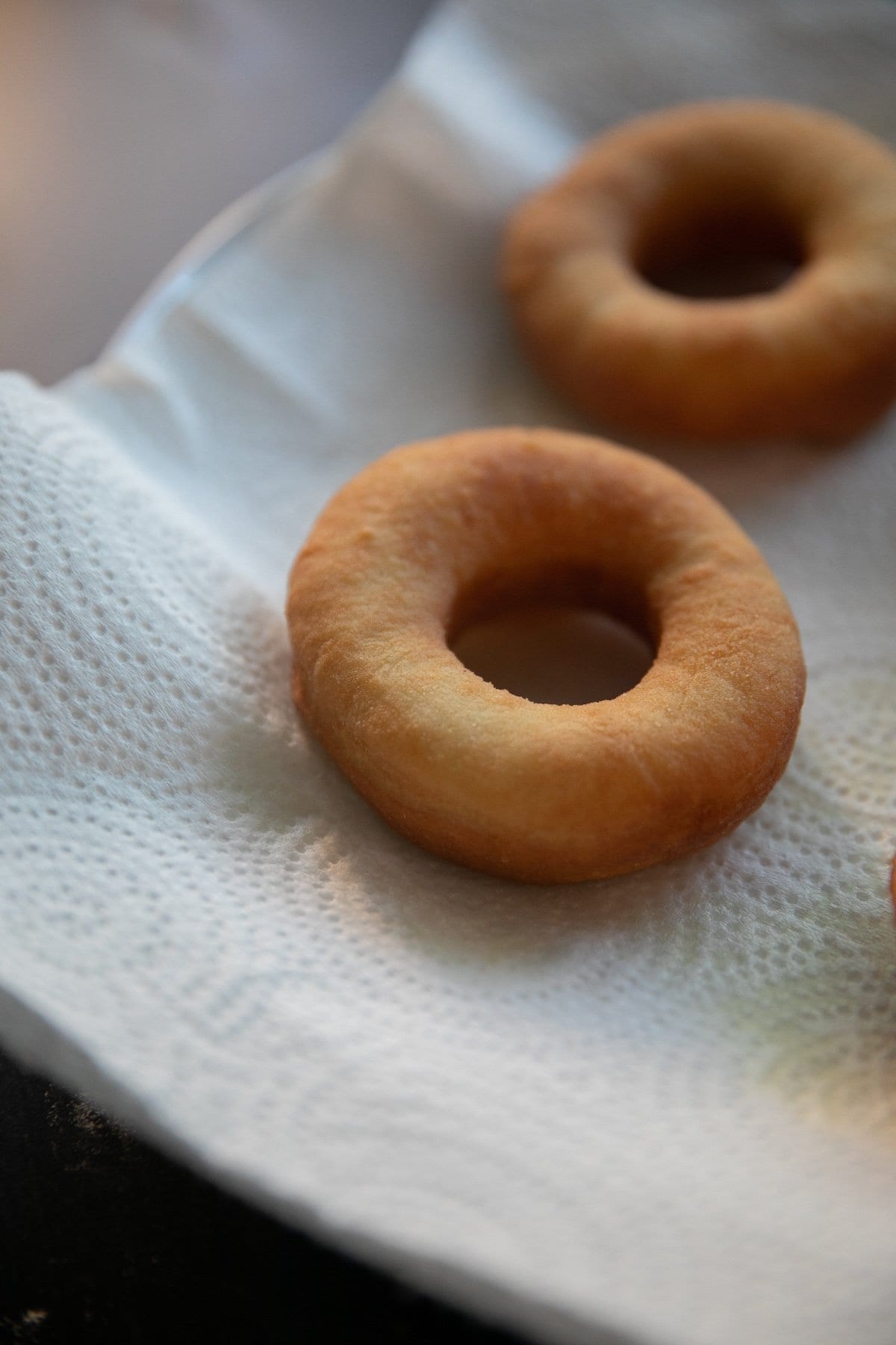 fried donut on a paper towel