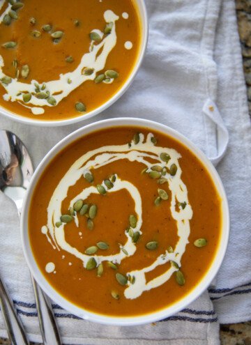 two bowls of pumpkin soup
