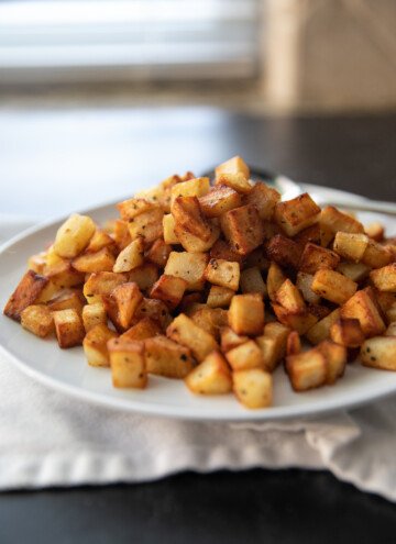 plate full of pan fried potatoes