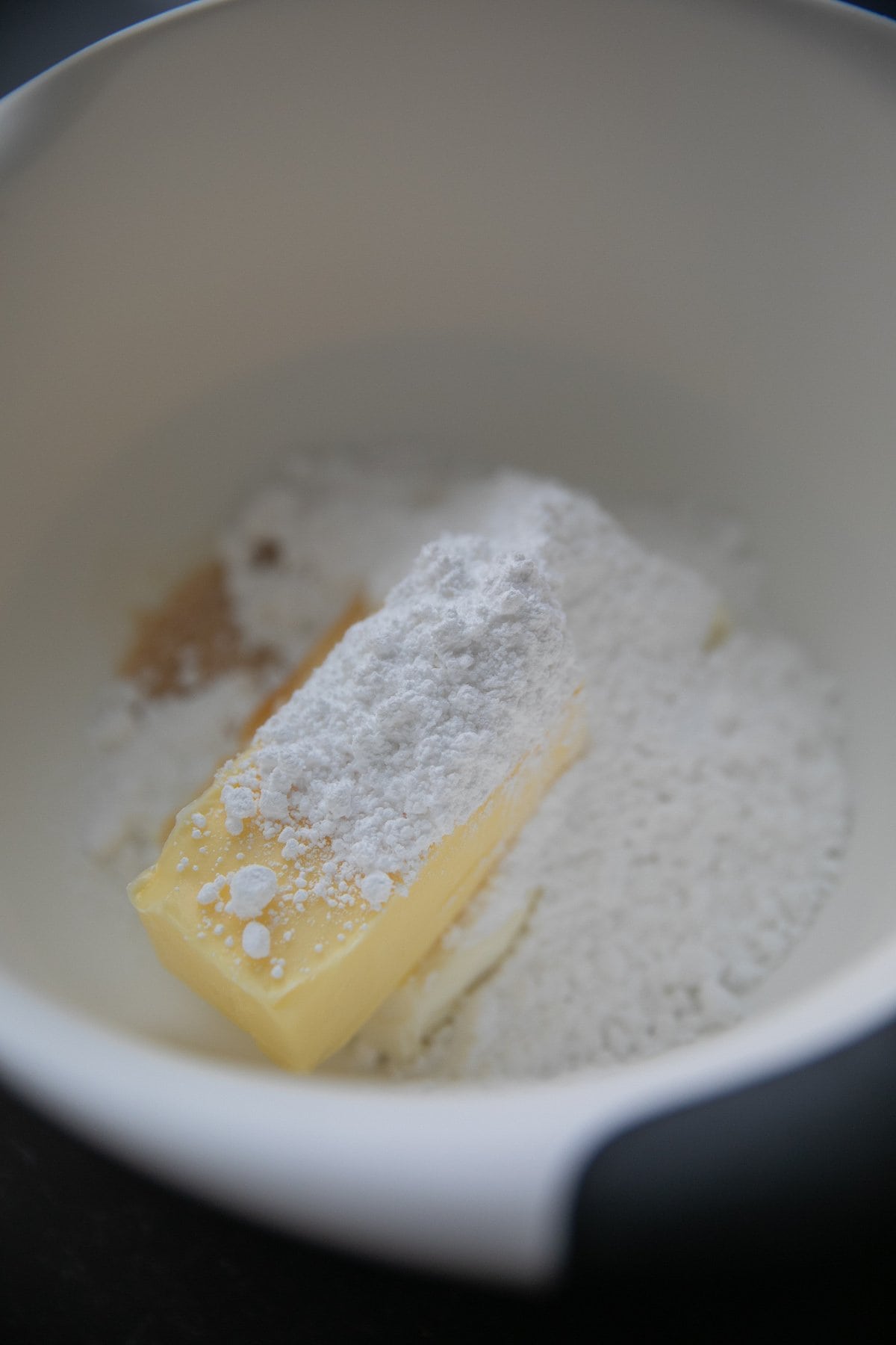 butter, powdered sugar and vanilla in a bowl unmixed