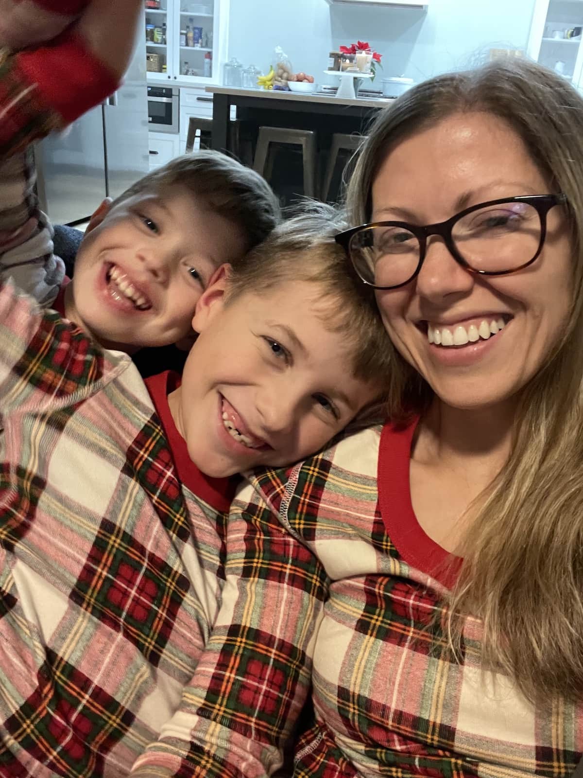 mom with two sons in pajamas