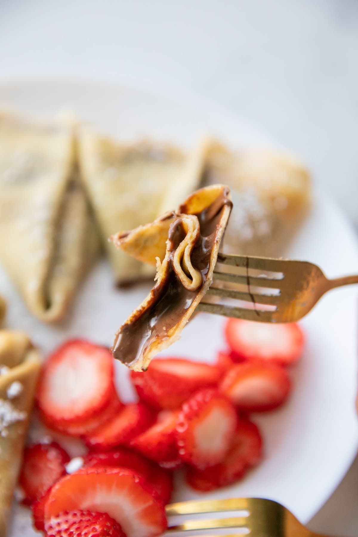piece of nutella crepe on fork