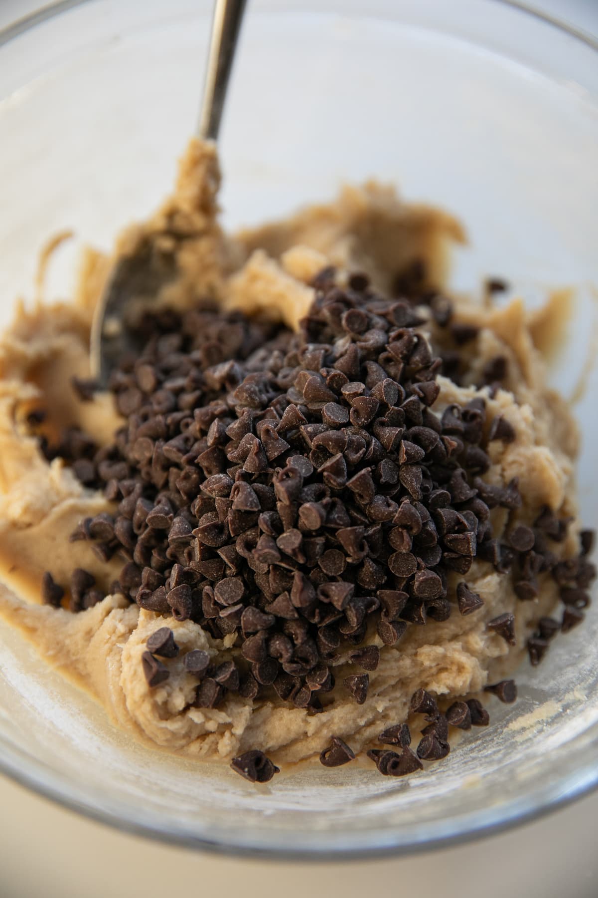 chocolate chips added into edible cookie dough