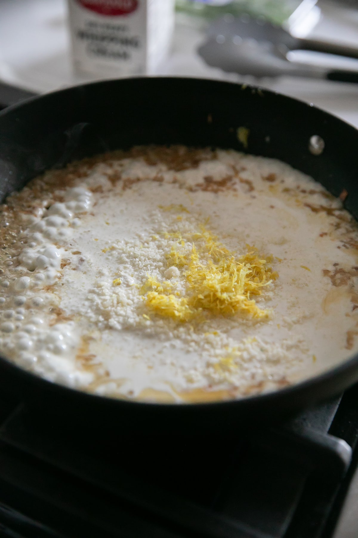 cream, cheese, lemon zest in pan