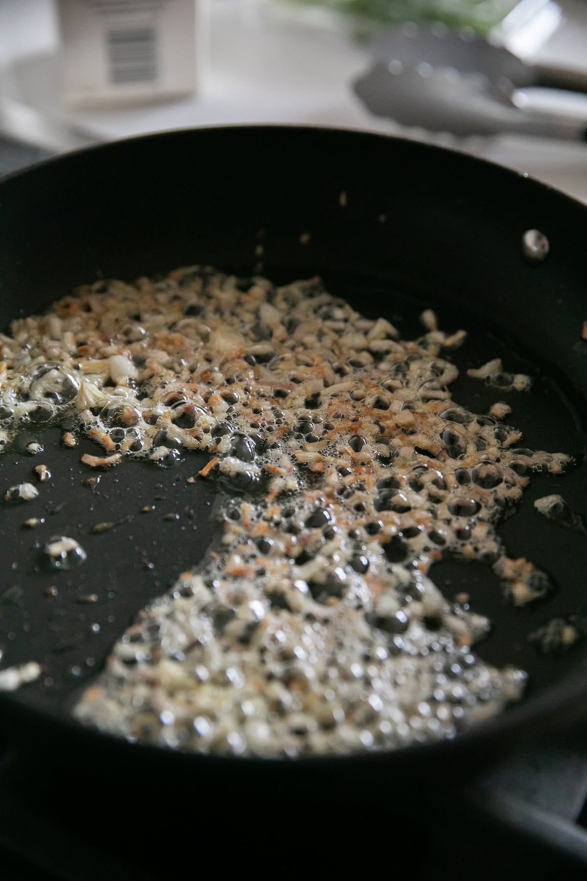 cooking shallots in a pan