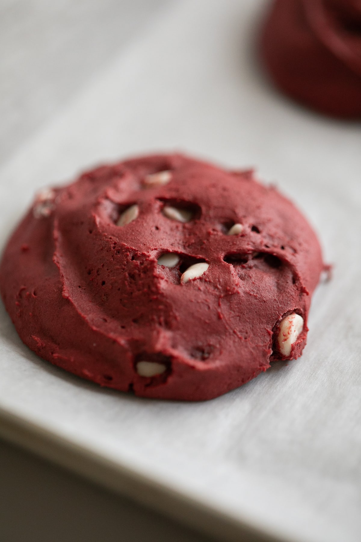 baked red velvet cookie on cookie sheet