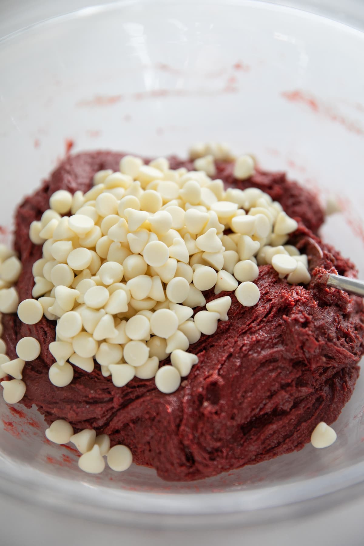 white chocolate chips added to red velvet cookie batter
