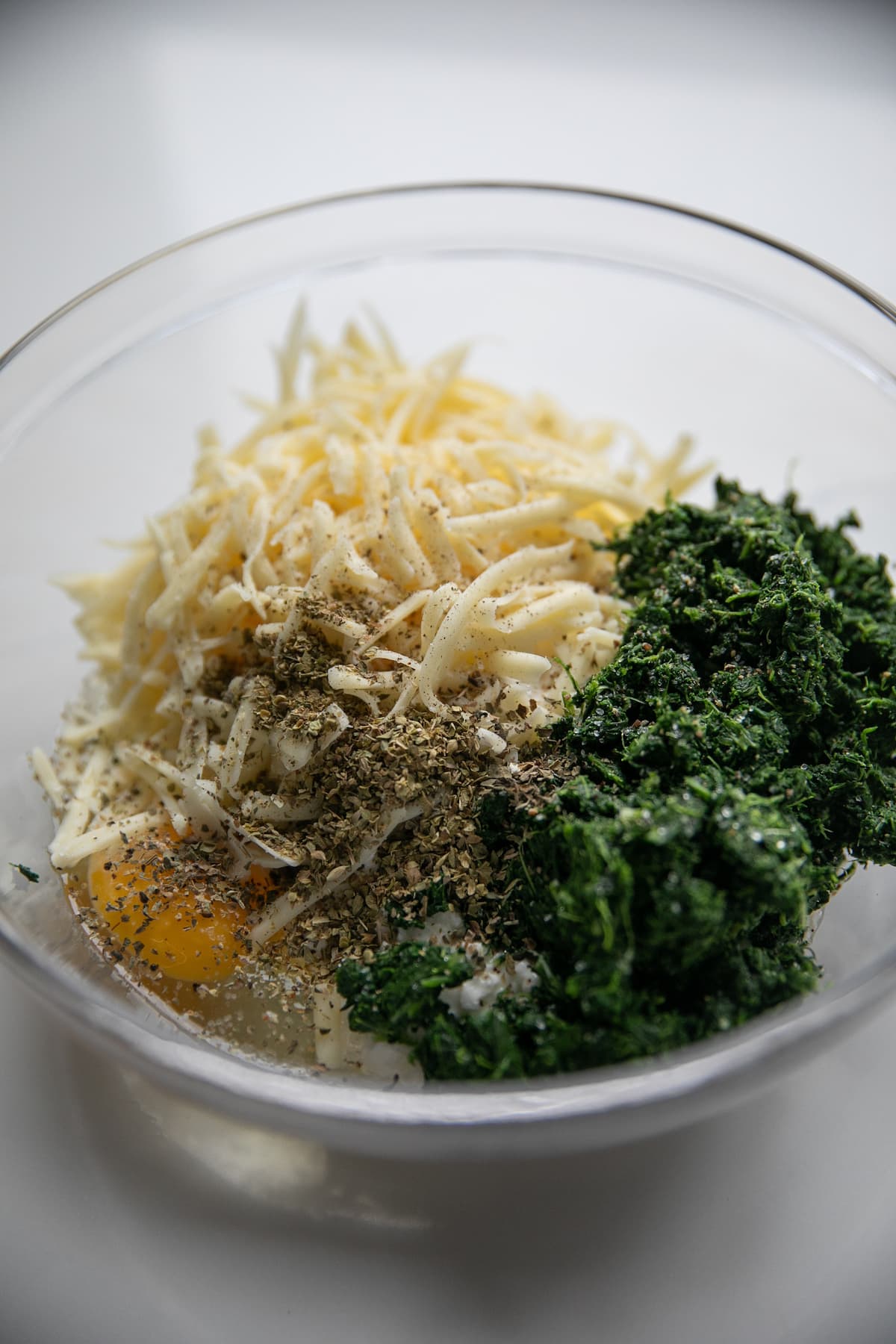 ingredients for cheese and spinach filling in bowl